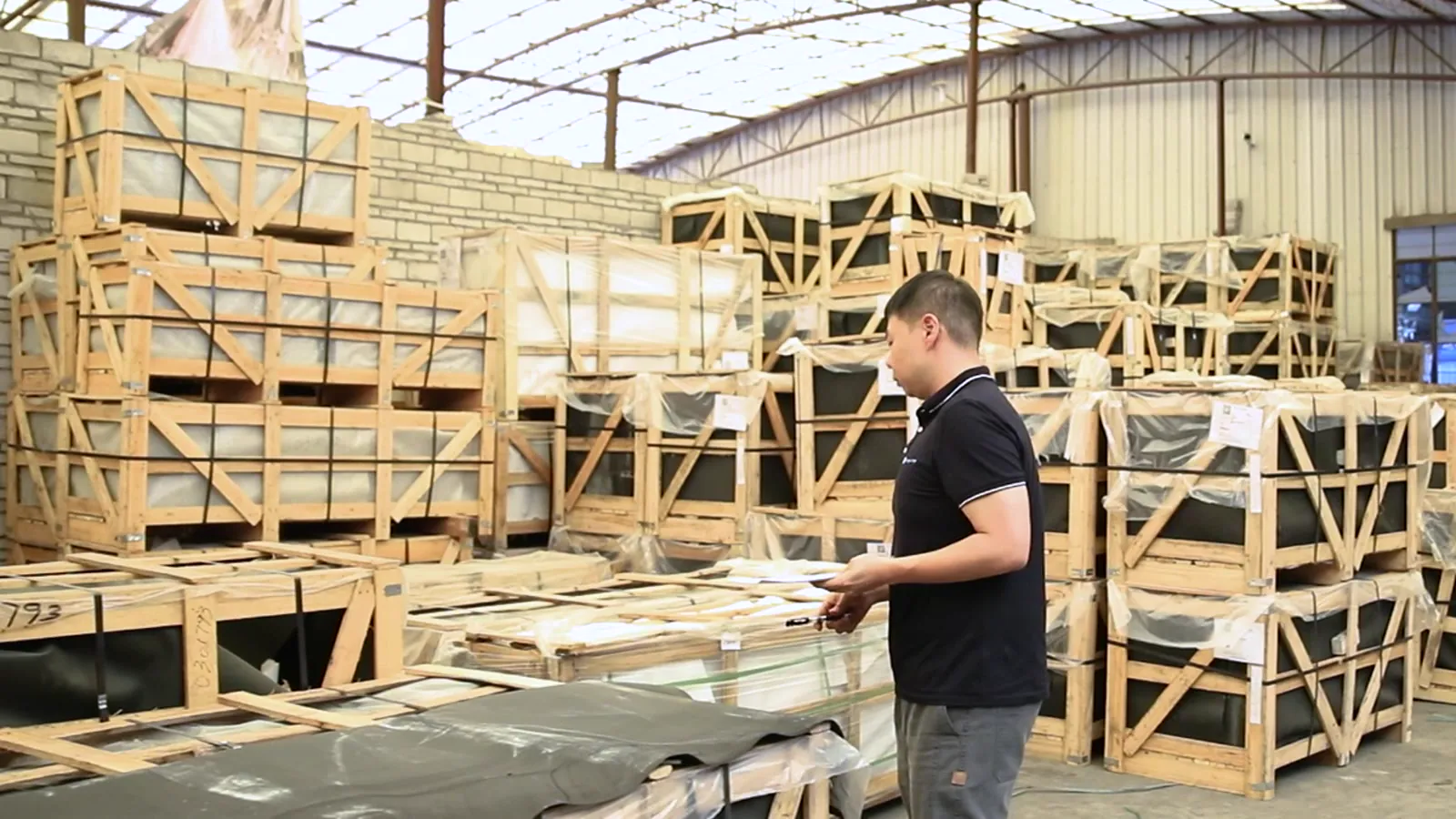 George Group warehouse team checking and organizing crated project products